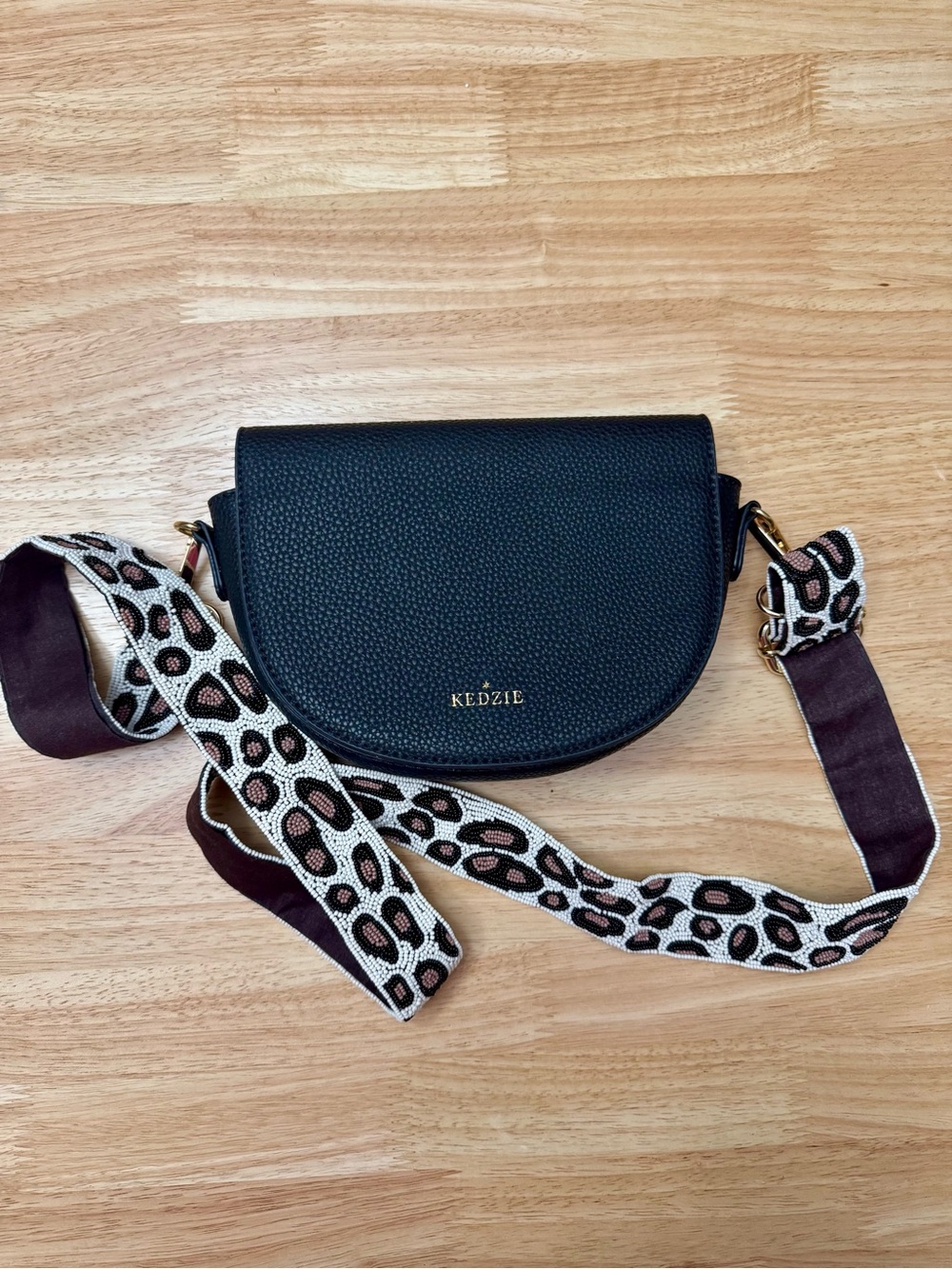 Kedzie Black Pebbled Leather Crossbody Bag with Patterned Strap